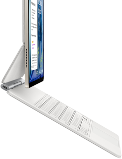 iPad Air, blanco estelar, conectado a un Magic Keyboard, color blanco, parte lateral